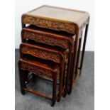 Chinese nest of four tables with carved blossom pattern, 73 x 51cm (4)