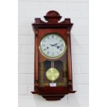 Mahogany cased wall clock, 65 x 30cm