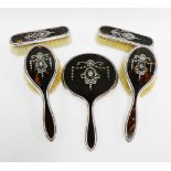 George V silver and tortoiseshell dressing table brush set comprising hand mirror, two hair