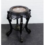 Ebonised hardwood jardiniere stand with red hardstone circular top, 58 x 50cm