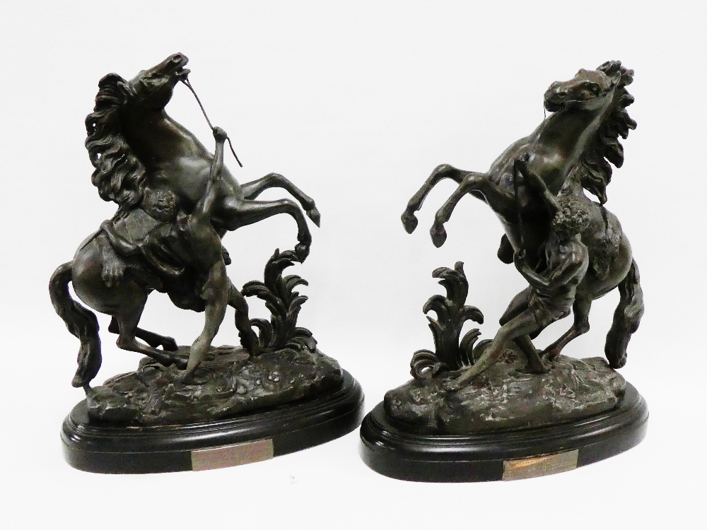 Pair of Victorian Spelter Marley Horse rearing horse figures on oval pedestal bases, 45cm high, (2)