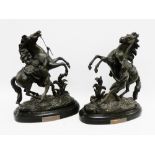 Pair of Victorian Spelter Marley Horse rearing horse figures on oval pedestal bases, 45cm high, (2)