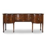 A William IV figured mahogany sideboard first half 19th century The two center drawers with locks by