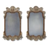 A pair of Queen Anne style silvered wood and parcel-gilt walnut girandoles early 20th century Of