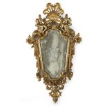 A Venetian Rococo giltwood and etched glass specchiera circa 1750 The original shaped mirror plate