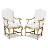A pair of Venetian Rococo giltwood armchairs mid 18th century The carved and re-gilt armchairs