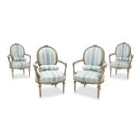 A suite of four Louis XVI style blue painted fauteuils early 20th century With blue silk upholstery.