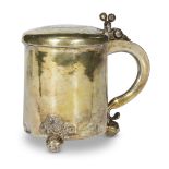 A silver-gilt tankard on three ball feet possibly German or Polish, engraved 1716 Of regular form,