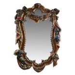 A Venetian polychromed figural mirror 19th century Allover decorated with carved swags and putti. H: