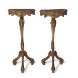 A pair of Venetian carved giltwood petits consoles with faux-marble painted tops late 19th/early