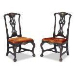 A pair of Portuguese Rococo parcel-gilt and ebonized side chairs 18th century With burt orange