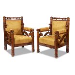 An unusual pair of Biedermeier walnut armchairs likely Budapest, second quarter 19th century Of