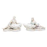 A pair of Meissen figural sweetmeat dishes 1815-1860 Each with blue underglaze crossed sword mark,
