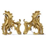 A pair of Régence/Louis XV ormolu chenets partially first quarter 18th century Of rocaille form