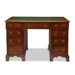 A Victorian mahogany pedestal desk third quarter 19th century Of typical form, the top inset with