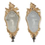 A pair of Italian Rococo giltwood and etched glass specchiere 18th century Each mounted with wrought