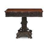 An Anglo-Indian carved and stained padouk games table late 19th century The shaped and moulded