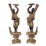 A pair of Venetian polychromed figural torchères 19th century H: 32 1/2 in. PROVENANCE: Property