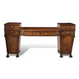 A Regency brass-mounted figured mahogany pedestal sideboard first quarter 19th century H: 44, W: 89,