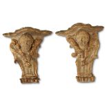 A pair of Italian Rococo polychromed and parcel-gilt figural corner brackets 18th/19th century H: