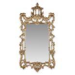 A George III style carved giltwood mirror mid 20th century H: 57, W: 30 in. (approx.) PROVENANCE: