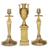 An assembled Empire style ormolu three-piece garniture 19th century Comprising a vase and an