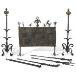 A whimsical collection of Gothic Revival cast and wrought iron fire tools 19th century, some