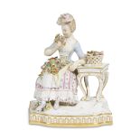 A Meissen porcelain figure of a flower seller 1815-1860 After the model by Johann Carl Schoenheit (