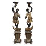 A pair of Venetian polychromed figural torchères on pedestals late 19th century H: 63 in.