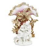 A Victorian parcel-gilt and fuchsia-glazed bisque 'exotic' figural vase mid 19th century The