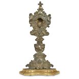 An Italian Baroque gilt and hammered copper and giltwood reliquary 18th/19th century Centered by a