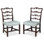 A pair of George III pierced ladderback mahogany chairs mid 18th century With inverted bellflower