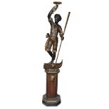 A large Venetian polychromed figural torchère on pedestal late 19th century H: 71 in.PROVENANCE: