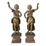 A pair of Italian gilt and polychromed carved wood figures in classical drapery 18th century H: 32