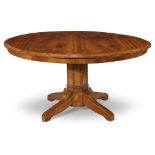 A Biedermeier cherry and walnut veneered center table in the Gothic style circa 1830-40 H: 29,