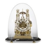 A Victorian brass skeleton clock 19th century Of Gothic architectural form, enclosed in glass