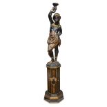 A large Venetian polychromed figural torchère on pedestal late 19th century H: 72 in. PROVENANCE: