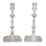 A pair of George II Brittania silver armorial candlesticks likely Ebenezer Coker, London, no visible