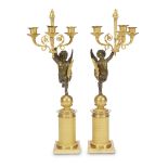 A fine pair of Empire ormolu and patinated bronze figural three-light candelabra attributed to