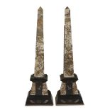 A pair of Egyptian Revival fleur de pêche and noir belge marble obelisks possibly French, 19th