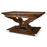 An unusual Swiss Baroque extending walnut dining table with 18th century elements Rectangular with a