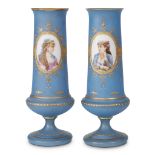 A large pair of hand-painted and parcel-gilt blue opaline glass vases with portraits of ladies