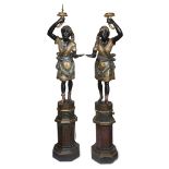 A pair of large Venetian polychromed figural torchères last quarter 19th century Comprising a male