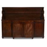 A William IV mahogany sideboardcirca 1840 With two shelves above four panelled cabinet doors. H: