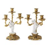 A pair of Louis XV style Höchst porcelain-mounted gilt-bronze figural three-light candelabra 19th