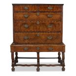 A William & Mary featherbanded and figured walnut chest on stand the chest late 17th century, the