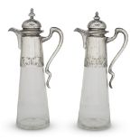 A pair of Austrian silver-mounted cut-glass claret jugs Franz Rumwolf, Vienna, circa 1900 The silver