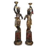 An impressive pair of Venetian polychromed figural torchères circa 1870-80 Comprising a male and