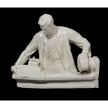 A Soviet porcelain group "Workman at the lathe" attributed to Dulevo Porcelain Manufactory,