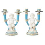 A pair of Minton parcel-gilt and turquoise glazed porcelain two-light figural candelabra early